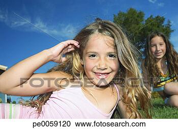 Stock Photography - two girls outdoors. 
fotosearch - search 
stock photos, 
pictures, images, 
and photo clipart