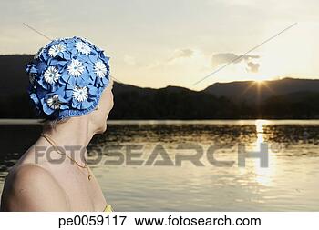 Picture - woman wearing 
swim cap outdoors 
by lake. fotosearch 
- search stock 
photos, pictures, 
images, and photo 
clipart