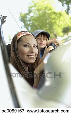 Picture - woman with young 
boy in convertible 
car smiling. fotosearch 
- search stock 
photos, pictures, 
images, and photo 
clipart
