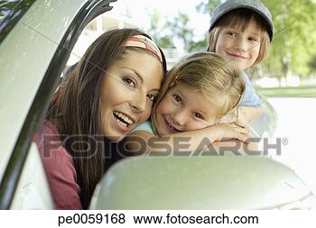 Stock Photo - woman with young 
boy and girl in 
convertible car 
smiling. fotosearch 
- search stock 
photos, pictures, 
images, and photo 
clipart