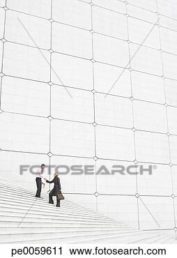 Stock Photography - two businesspeople 
outdoors on staircase 
shaking hands. 
fotosearch - search 
stock photos, 
pictures, images, 
and photo clipart