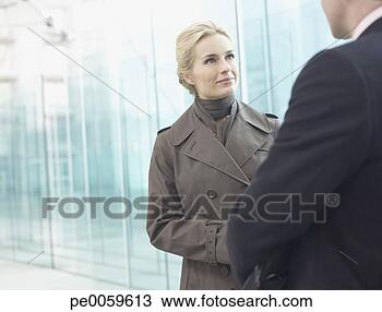 Stock Photo - two businesspeople 
outdoors talking. 
fotosearch - search 
stock photos, 
pictures, images, 
and photo clipart
