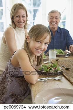 Stock Photo - couple and young 
girl at dining 
room table. fotosearch 
- search stock 
photos, pictures, 
images, and photo 
clipart