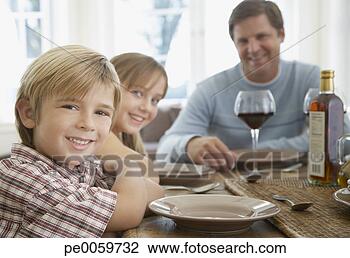 Stock Photo - man and two kids 
at dining room 
table. fotosearch 
- search stock 
photos, pictures, 
images, and photo 
clipart