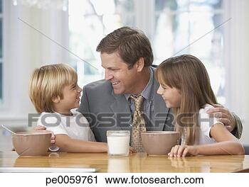 Stock Photography - man and two young 
kids in kitchen 
bonding. fotosearch 
- search stock 
photos, pictures, 
images, and photo 
clipart