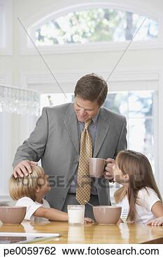 Stock Photo - man and two young 
kids in kitchen 
bonding. fotosearch 
- search stock 
photos, pictures, 
images, and photo 
clipart
