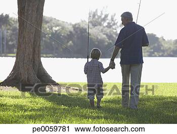 Stock Photography - man and young 
boy with fishing 
poles outdoors 
at park by a lake. 
fotosearch - search 
stock photos, 
pictures, images, 
and photo clipart