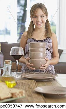 Picture - young girl in 
dining room setting 
table. fotosearch 
- search stock 
photos, pictures, 
images, and photo 
clipart