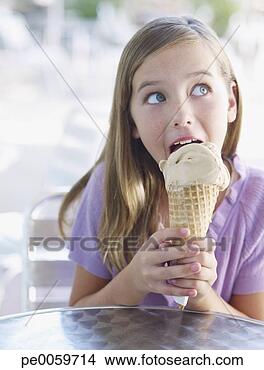Stock Photo - young girl on 
outdoor patio 
licking ice cream 
cone. fotosearch 
- search stock 
photos, pictures, 
images, and photo 
clipart