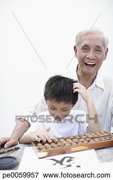 Picture - man and young 
boy indoors at 
table with abacus. 
fotosearch - search 
stock photos, 
pictures, images, 
and photo clipart
