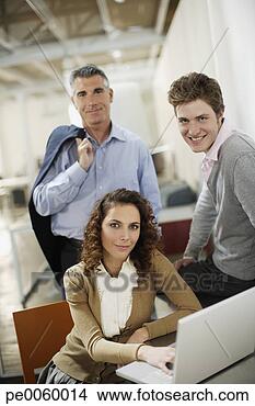 Stock Photo - three businesspeople 
in office with 
laptop. fotosearch 
- search stock 
photos, pictures, 
images, and photo 
clipart