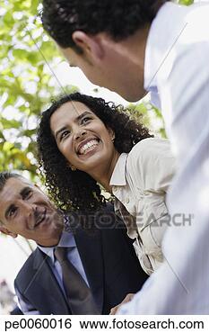 Stock Photo - three businesspeople 
outdoors talking 
and laughing. 
fotosearch - search 
stock photos, 
pictures, images, 
and photo clipart