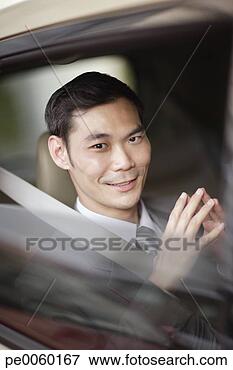Picture - businessman sitting 
in car. fotosearch 
- search stock 
photos, pictures, 
images, and photo 
clipart