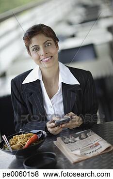 Stock Photo - businesswoman 
on outdoor patio 
with personal 
digital assistant 
and. fotosearch 
- search stock 
photos, pictures, 
images, and photo 
clipart