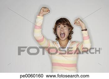 Stock Photography - man indoors cheering. 
fotosearch - search 
stock photos, 
pictures, images, 
and photo clipart
