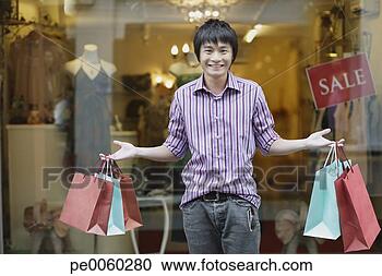 Stock Photography - man outdoors with 
shopping bags. 
fotosearch - search 
stock photos, 
pictures, images, 
and photo clipart