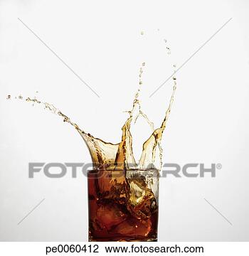 Stock Photo - beverage indoors 
with ice being 
dropped in splashing. 
fotosearch - search 
stock photos, 
pictures, images, 
and photo clipart