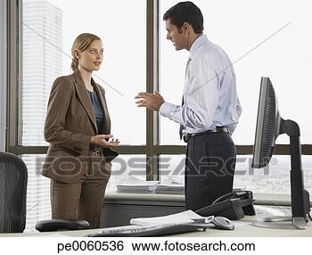 Stock Photo - businessman and 
businesswoman 
in an office talking. 
fotosearch - search 
stock photos, 
pictures, images, 
and photo clipart