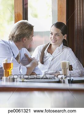 Stock Photography - man and woman 
sitting at a bar 
talking. fotosearch 
- search stock 
photos, pictures, 
images, and photo 
clipart