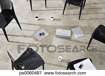 Picture - six empty chairs 
indoors around 
a laptop and folders. 
fotosearch - search 
stock photos, 
pictures, images, 
and photo clipart