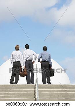 Picture - three businessmen 
outdoors at top 
of staircase looking 
up. fotosearch 
- search stock 
photos, pictures, 
images, and photo 
clipart