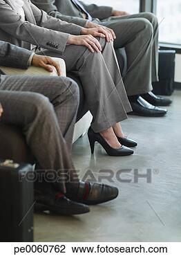 Stock Photo - three business 
people's legs 
in an office lobby. 
fotosearch - search 
stock photos, 
pictures, images, 
and photo clipart