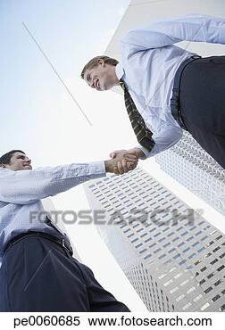 Stock Image - two businessmen 
outdoors shaking 
hands. fotosearch 
- search stock 
photos, pictures, 
images, and photo 
clipart