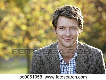 Stock Photo - man outdoors looking 
at camera. fotosearch 
- search stock 
photos, pictures, 
images, and photo 
clipart