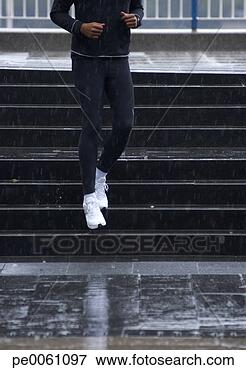 Picture - man coming down 
steps in the rain. 
fotosearch - search 
stock photos, 
pictures, images, 
and photo clipart