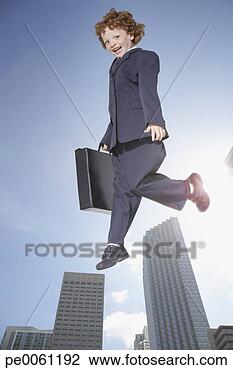 Banco de Imagem - jovem,  menino, 
 ao ar livre, 
 negócio,  paleto, 
 pular,  ar. fotosearch 
- busca de fotos, 
imagens e clipart