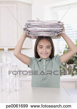 Stock Photograph - young girl in 
kitchen with recyclable 
materials smiling. 
fotosearch - search 
stock photos, 
pictures, images, 
and photo clipart