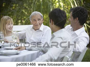 Stock Photo - senior man and 
young girl at 
outdoor party 
talking to two 
men and. fotosearch 
- search stock 
photos, pictures, 
images, and photo 
clipart