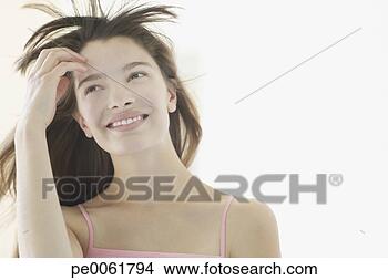 Banco de Imagem - mulher,  sorrindo, 
 cabelo,  soprando, 
 costas. fotosearch 
- busca de fotos, 
imagens e clipart