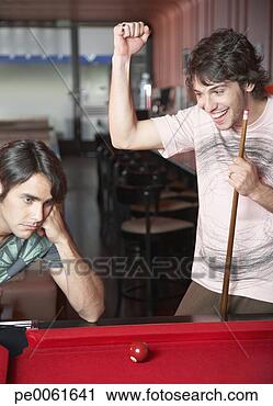 Stock Photography - two men playing 
pool with one 
making a winning 
shot and smiling. 
fotosearch - search 
stock photos, 
pictures, images, 
and photo clipart