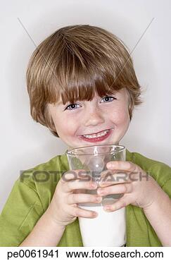 Stock Photography - young boy with 
glass of milk 
smiling. fotosearch 
- search stock 
photos, pictures, 
images, and photo 
clipart