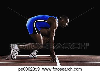 Stock Photograph - runner on race 
track at his mark. 
fotosearch - search 
stock photos, 
pictures, images, 
and photo clipart