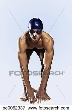 Picture - swimmer wearing 
cap and goggles 
on his mark. fotosearch 
- search stock 
photos, pictures, 
images, and photo 
clipart