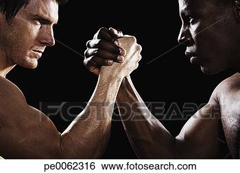 Stock Photo - two men arm wrestling. 
fotosearch - search 
stock photos, 
pictures, images, 
and photo clipart