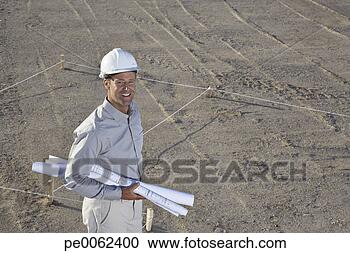 Arquivo de Fotografias - construção,   
capataz,   segurando, 
  desenhos técnicos. 
fotosearch - busca 
de fotos, imagens 
e clipart