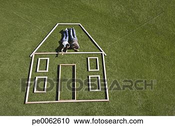 Stock Photography - couple laying 
inside house outline. 
fotosearch - search 
stock photos, 
pictures, images, 
and photo clipart