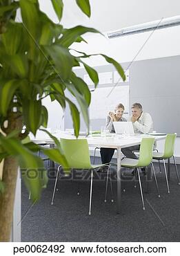 Stock Photo - business people 
working in conference 
room. fotosearch 
- search stock 
photos, pictures, 
images, and photo 
clipart