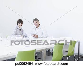 Stock Photo - business people 
working in conference 
room. fotosearch 
- search stock 
photos, pictures, 
images, and photo 
clipart