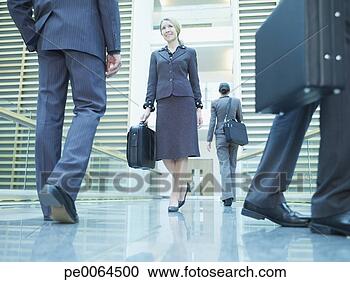 Stock Photography - businesspeople 
walking in corridor. 
fotosearch - search 
stock photos, 
pictures, images, 
and photo clipart