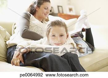 Stock Photo - girl laying in 
mother’s lap. 
fotosearch - search 
stock photos, 
pictures, images, 
and photo clipart