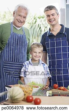 Stock Photo - grandfather, father 
and son preparing 
healthy meal. 
fotosearch - search 
stock photos, 
pictures, images, 
and photo clipart
