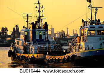 Stock Photo - tugboats at port 
of rotterdam. 
fotosearch - search 
stock photos, 
pictures, images, 
and photo clipart