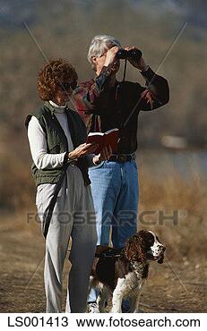 Stock Photo - couple birdwatching. 
fotosearch - search 
stock photos, 
pictures, images, 
and photo clipart