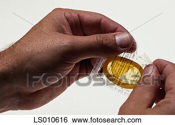 Stock Photo - opening a condom 
package. fotosearch 
- search stock 
photos, pictures, 
images, and photo 
clipart