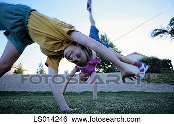 Stock Photo - girl turning somersault. 
fotosearch - search 
stock photos, 
pictures, images, 
and photo clipart