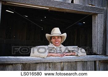 Stock Photography - cowgirl on ranch. 
fotosearch - search 
stock photos, 
pictures, images, 
and photo clipart
